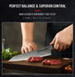 Chef hand holding Damara Kensei knife cutting meat demonstrating perfect balance and control